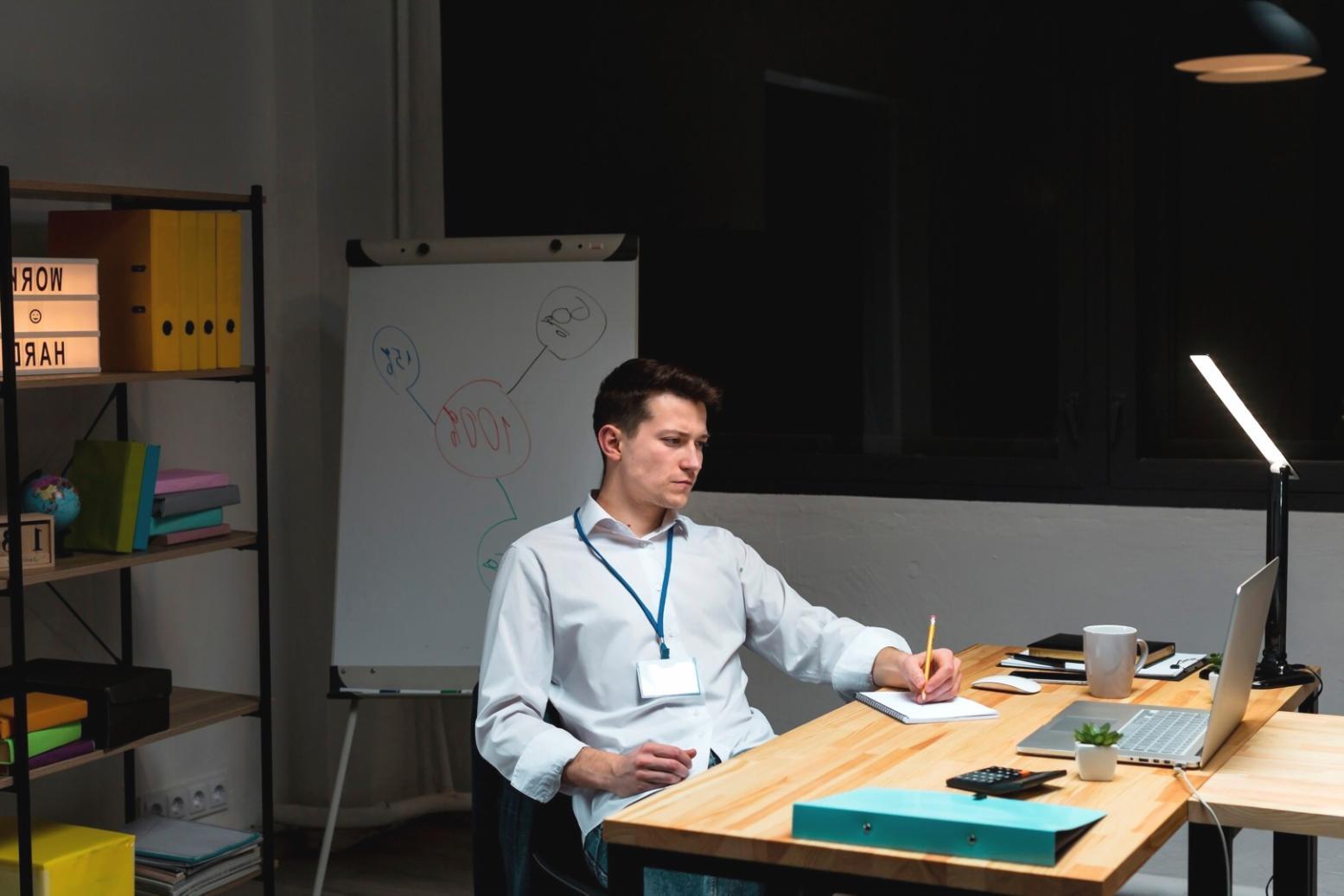 Students collaborating on coding projects in modern learning environment